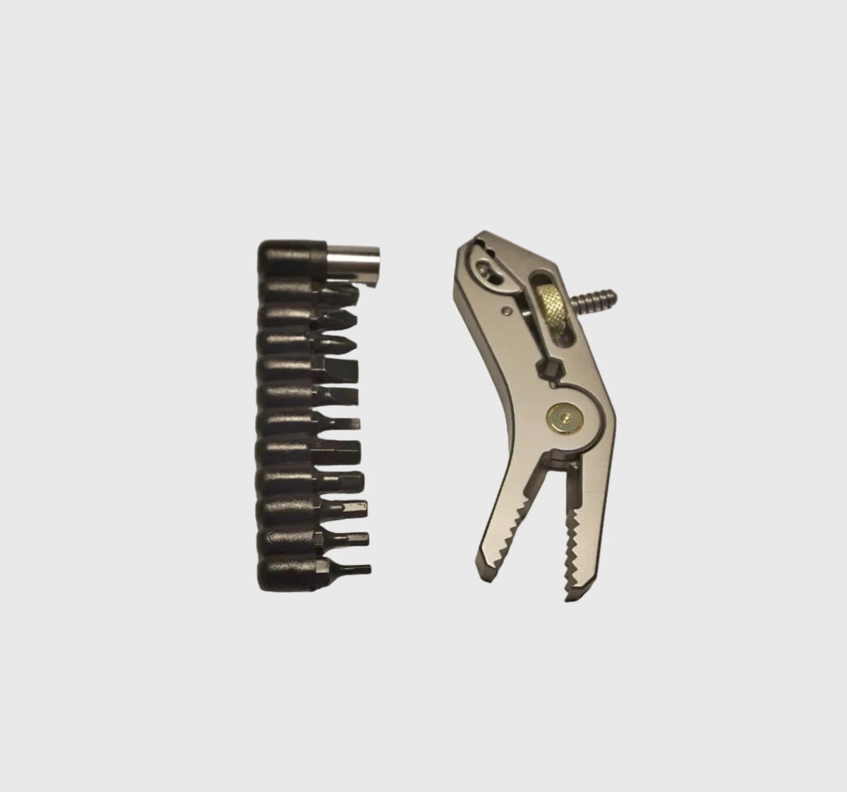 THE HYBRID MULTI GRIP - Averx GearSet of drill bits and a plier on a light gray backgroundAVERX Gear